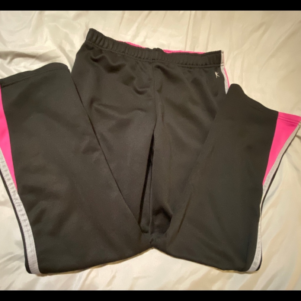 Gently worn Danskin Now black athletic pants with gray and pink stripe details.